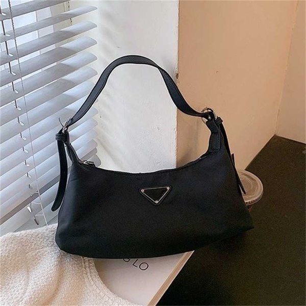 design purse triangle standard bag women's new fashion nylon oxford small messenger sling single shoulder armpit
design purse triangle standard bag women's new fashion nylon oxford small messenger sling single shoulder armpit