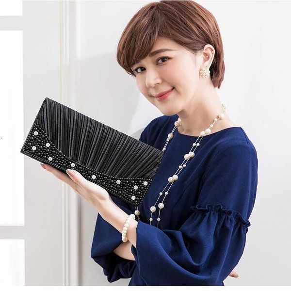 new japan and south korea versatile wrinkle manual simulation nail bead wave handbag dinner bag grab bag b5575
new japan and south korea versatile wrinkle manual simulation nail bead wave handbag dinner bag grab bag b5575
