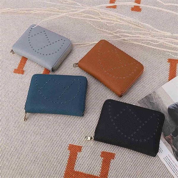 women's bag leather laser perforated short women's purse 
women's bag leather laser perforated short women's purse