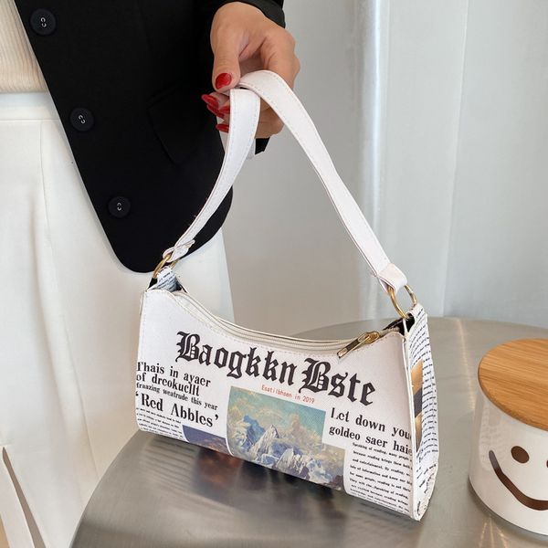 evening bags fashion women spaper letter printing pu leather shoulder underarm bag casual ladies small purse buckle handbags 221119
evening bags fashion women spaper letter printing pu leather shoulder underarm bag casual ladies small purse buckle handbags 221119