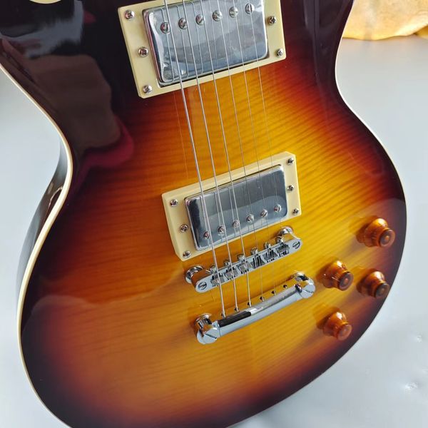 lp electric guitar brown tiger patter made of mahogany silver cartridge case accessories and tail piece quick packaging
lp electric guitar brown tiger patter made of mahogany silver cartridge case accessories and tail piece quick packaging