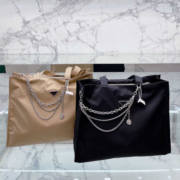 the new luxury designer brand shopping bags women triangle waterproof leisure travel shoulde bag high capacity nylon mommy large totes
the new luxury designer brand shopping bags women triangle waterproof leisure travel shoulde bag high capacity nylon mommy large totes
