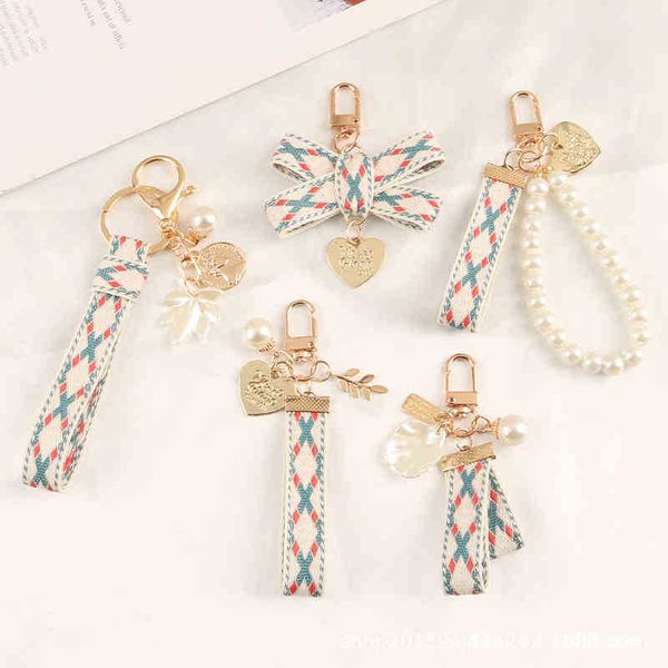 keychains new small fresh ribbon car alloy key chain pendant creative striped cloth belt pearl love accessories, Silver
keychains new small fresh ribbon car alloy key chain pendant creative striped cloth belt pearl love accessories, Silver