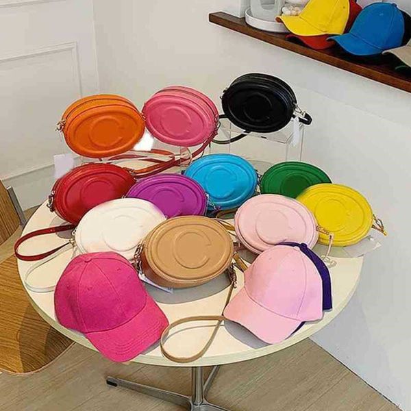 round cake bag solid color texture single shoulder messenger bag commuter purse with baseball hat 220617
round cake bag solid color texture single shoulder messenger bag commuter purse with baseball hat 220617