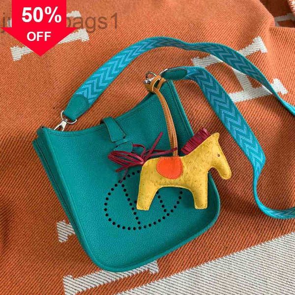 dhl h family evelyn mini perforated bucket new women' meenger bag texture 
dhl h family evelyn mini perforated bucket new women' meenger bag texture