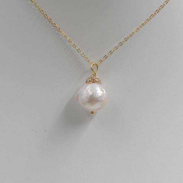 handmade studio natural 14 mm white unusual near round drip baroque pearl pendant, Silver
handmade studio natural 14 mm white unusual near round drip baroque pearl pendant, Silver