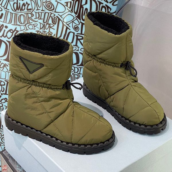 padded nylon booties inspired classic snow boots by compact lines sophisticated details rubber triangle logo completing design underlines it, Black
padded nylon booties inspired classic snow boots by compact lines sophisticated details rubber triangle logo completing design underlines it, Black