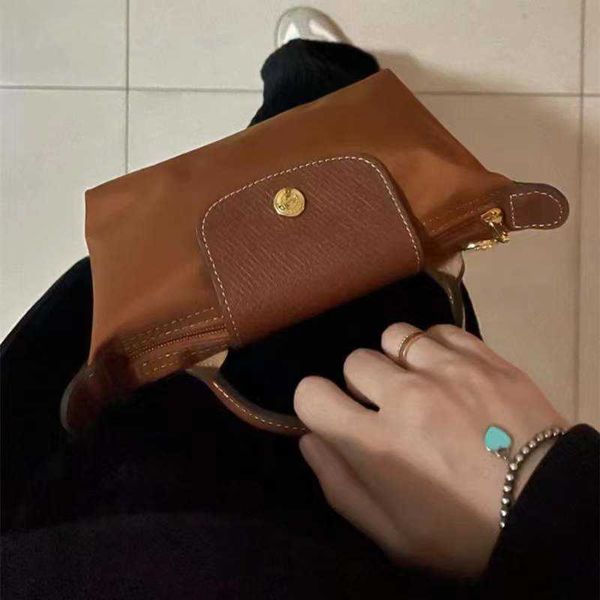 nylon dumpling bag in spring and summer mini cowhide hand large capacity cosmetic cognac color hand, Silver
nylon dumpling bag in spring and summer mini cowhide hand large capacity cosmetic cognac color hand, Silver