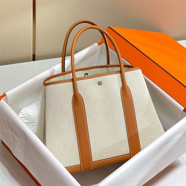 garden party bag totes 7a genuine canvas splicing designer handbag large capacity shopping fashion women's luxury canvas brand handmade
garden party bag totes 7a genuine canvas splicing designer handbag large capacity shopping fashion women's luxury canvas brand handmade