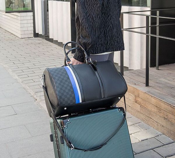luxurys designer duffel bags carry on all bandouliere 55 50 45 cm women travel bag fashion men classic leather sport outdoor packs soft side
luxurys designer duffel bags carry on all bandouliere 55 50 45 cm women travel bag fashion men classic leather sport outdoor packs soft side