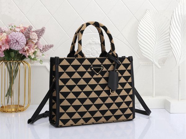 classic triangle-shaped tote bag with a single shoulder strap strap and detachable leather key chain240x
classic triangle-shaped tote bag with a single shoulder strap strap and detachable leather key chain240x