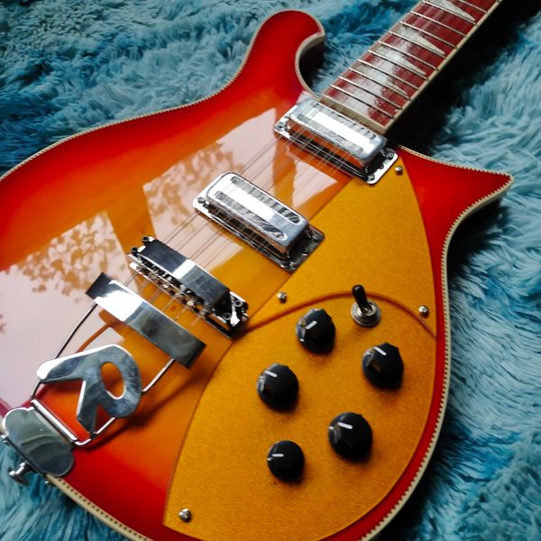 Striking Sunburst Electric Guitar: Red-to-Orange Gradient, Golden Pickguard & Metallic Tremolo
Striking Sunburst Electric Guitar: Red-to-Orange Gradient, Golden Pickguard & Metallic Tremolo