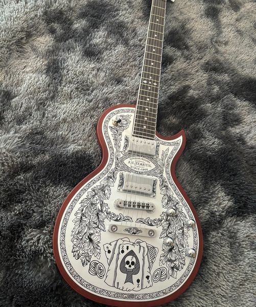 Striking White Solid-Body Guitar: Intricate Black Patterns, Red Border & Metallic Hardware 
Striking White Solid-Body Guitar: Intricate Black Patterns, Red Border & Metallic Hardware