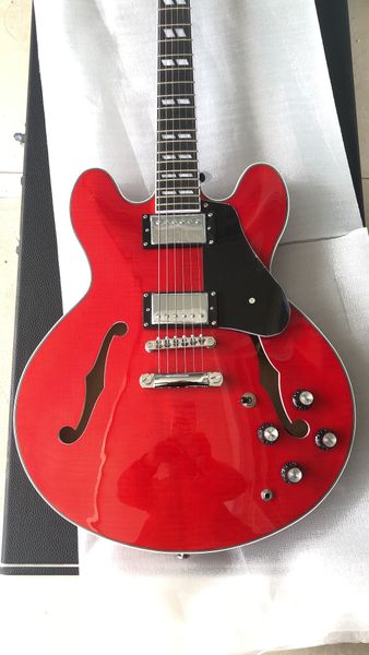 Vibrant Red Electric Guitar: Semi-Hollow Body, F-Holes & Warm Jazz/Rock Tones
Vibrant Red Electric Guitar: Semi-Hollow Body, F-Holes & Warm Jazz/Rock Tones