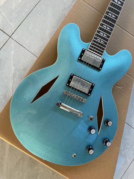 Turquoise Metallic Semi-Hollow Guitar - F-Hole Resonance & Humbucker Power
Turquoise Metallic Semi-Hollow Guitar - F-Hole Resonance & Humbucker Power