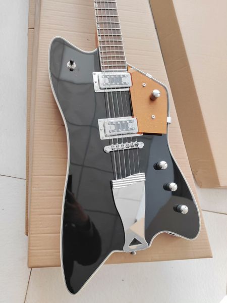 Striking Angular Black Electric Guitar: Light-Brown Accents, Dual Humbuckers, Metallic Bridge
Striking Angular Black Electric Guitar: Light-Brown Accents, Dual Humbuckers, Metallic Bridge