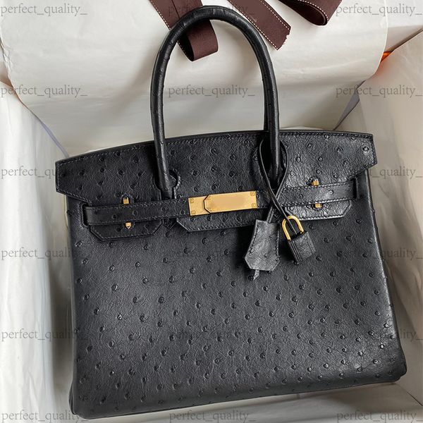 99A Premium Designer Ostrich Leather Women's Handbag, featuring pure steel hardware components and hand-sewn with wax thread, made of 100% genuine leather., One
99A Premium Designer Ostrich Leather Women's Handbag, featuring pure steel hardware components and hand-sewn with wax thread, made of 100% genuine leather., One