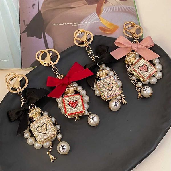 luxury keychains big brand New Handmade Bowknot Pearl Key Chain with rhinestone perfume Bottle Car keychain Womens Bag PendantXJ251114