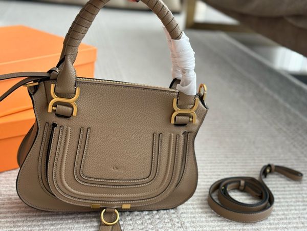 Designer Handheld saddle bag with suede/tassels/rivets/horseshoe buckles incorporating trendy elements!, C2
Designer Handheld saddle bag with suede/tassels/rivets/horseshoe buckles incorporating trendy elements!, C2