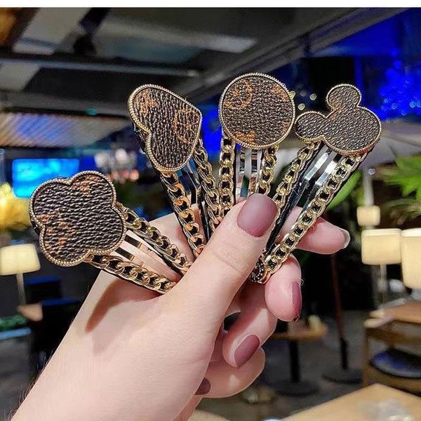Retro leather metal heart-shaped hair clip leather bangs edge clip hair accessory
Retro leather metal heart-shaped hair clip leather bangs edge clip hair accessory