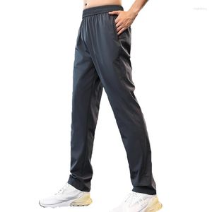 Pantalones activos 2023 Running Cordón Ropa de calle para hombres Leggings deportivos lisos con colores negro gris azul Pista personalizada Pantalón hasta el tobillo