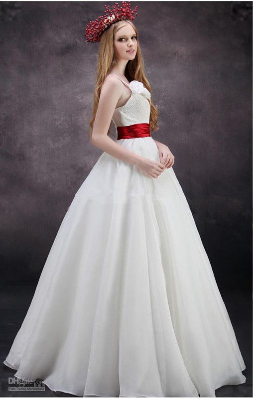 wedding dress with large red ribbon
