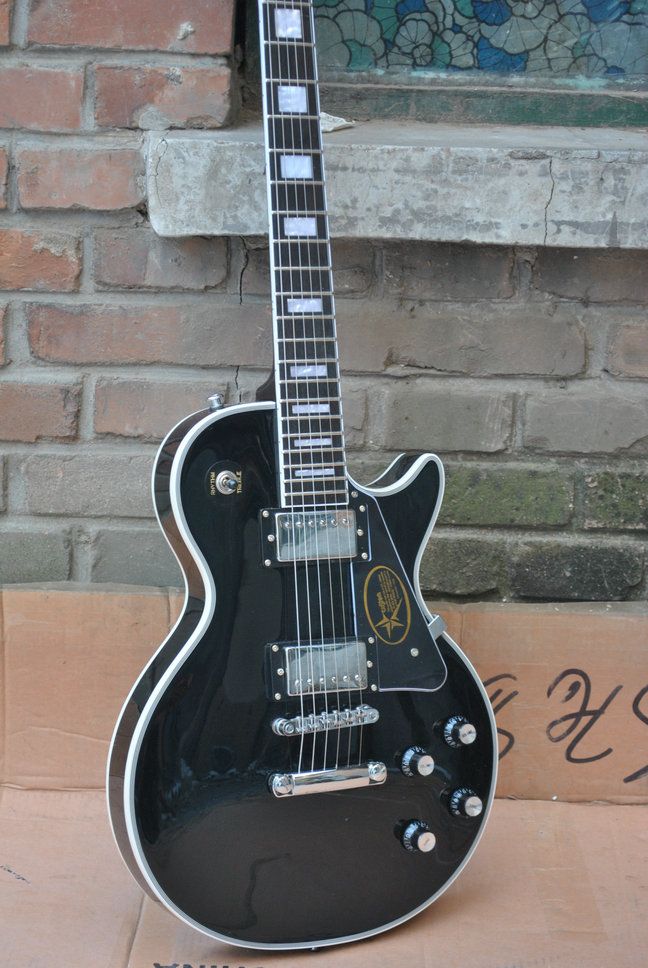 Black Custom Shop Guitar With Chrome Hardware And Chrome Tulip Tuners