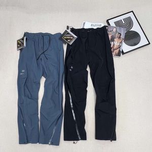 Pantalones impermeables Arc Pantalones de esquí Diseñador para hombre Cortavientos Cáscara dura Pantalones de chándal con cremallera completa Ropa de esquí al aire libre