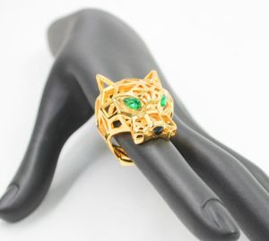 Anillos de banda Moda Hollow Leopard Animal Anillo de dedo Ojos verdes Hollow Panther Heads Anillos para hombres Mujeres Joyería de fiesta4473674 x0920