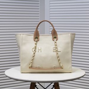 Fourre-tout de plage pour femmes Sac à provisions Mode Sac à bandoulière Lasies Toile Designer Sacs de plage avec chaîne Sac à main de luxe Perles de lin CC Bandoulière Sac de voyage