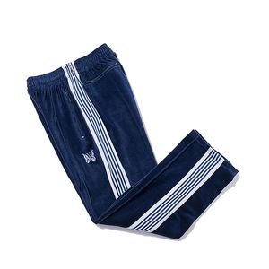 Pantalones de terciopelo de rayas blancas azul