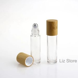 Bouteilles en gros huile 10 ml en verre essentiel en verre transparent transparent en verre rouleau sur les huiles bouteille bambou couvercle en acier inoxydable à rouleau d'échantillon de flacons