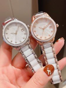 Marque Classique Saphir Quartz Montre Naturel Nacre Cadran Femmes En Acier Inoxydable Calendrier Montre-Bracelet Femme Blanc Bracelet En Céramique Horloge Étanche 33mm