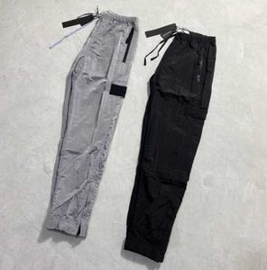 Diseñadores de marca Pantalones de piedra Metal de metal Nylon Insignia bordada pantalones casuales delgados deportes de isla reflectante que funciona 445s