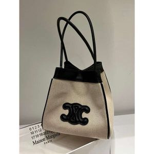 Bolso de cubo bolso de mensajero diseñador cel Cubo de cuero dividido de lona La piel de vaca tiene una hermosa capacidad Artículos de cuero de color claro Diseño de nicho de la Puerta Este de Corea ca Z A09P