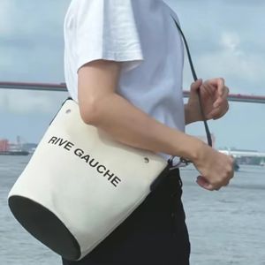 Rive Gauche Bolso tipo cubo con cierre de botón a presión Bolso de lona Bolso de cuero acolchado de diseñador Bolso de hombro ajustable para mujer y hombre Bolsos de hombro Monedero