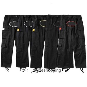 Pantalons de cargaison Mentes Black Streetwear Hip Hop Imprimé Pantalons décontractés Military Retro Multi-poches Saut-poches en vrac Bouton Fly Couple JEG WRAG ORIFF