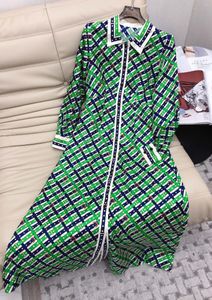 Robes décontractées 2023 Printemps / Été Vert Imprimer Chaîne de revers Taille Enveloppée Robe en soie à manches longues Maxi Femme Jupe
