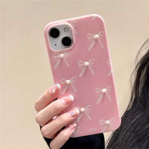 Cas de téléphone portable coréen mignon rose chaud arc 3d perle de téléphone en silicone doux adapté à l'iPhone 15 14 12 pro max 11 mignon couverture arrière de brillance à l'arc J240418