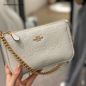 Barato al por mayor liquidación limitada 50% de descuento bolso nuevo para mujer bolso Nolita relieve flor vieja llevar a mano cadena de perlas axila