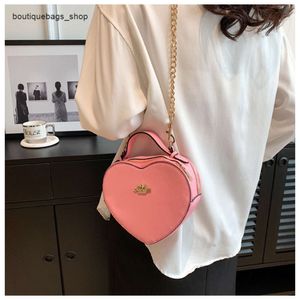 Pas cher en gros liquidation limitée 50% de réduction sac à main nouveau sac d'amour à la mode et populaire une épaule en forme de maquillage pour les femmes