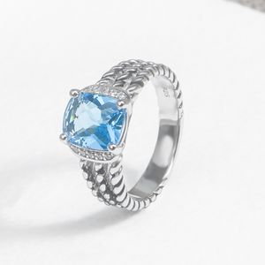 Anillo clásico para mujer con incrustaciones de topacio azul Color Zircon Anillos de cable trenzado retro