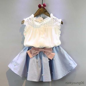 Conjuntos de ropa Ropa para niños Niñas Nueva camisa con cuello de volantes Blusa TopsandBowknot Falda Trajes Conjunto 2PCS Venta al por mayor