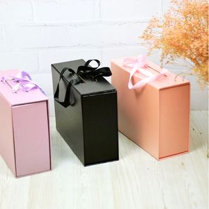 Caja de regalo de peluca de extensión de cabello magnética plegable de papel blanco rojo negro personalizado con cinta de seda rosa