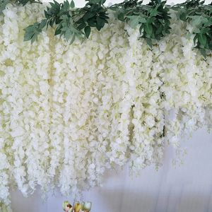 Couronnes de fleurs décoratives 20 pièces en gros rotin de glycine blanche avec feuilles tenture murale fausses fleurs guirlande toile de fond florale vignes décor de fête de mariage 231207