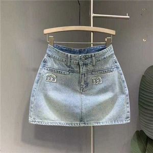 Jupe en jupe denim Jupes pour femmes avec une mini jupe à taille haute ceinturée pour femme Summer Corée denim jeans Ladies Blue Streetwear Harajuku Vintage N72U #