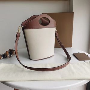 Petit sac à main en cuir de vachette avec poignée ovale et sac croisé en diagonale, particulièrement adapté aux belles femmes qui aiment les sacs à main classiques