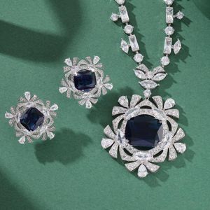 Colección de diseñador Estilo Collar Pendientes Mujer Lady Inlay Cubic Zircon Diamante Verde Azul Gema Forma de copo de nieve Colgante Chapado en cadena de oro Conjuntos de joyería de alta gama