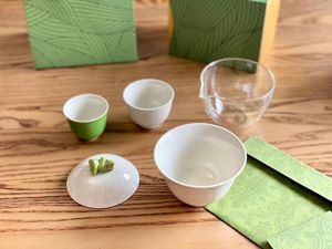 Juego de té de viaje verde de diseñador, práctico juego de té Zongzi portátil, paquete de caja de regalo de hoja de bambú verde con bolso, juego de preparación de té