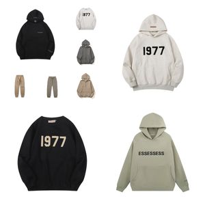 Sudadera con capucha de diseñador para hombre Essentialshoodie Man 1977 Set Essentialsweatshirts Mujeres Jóvenes Manga larga con capucha Carta impresa Sudaderas sueltas